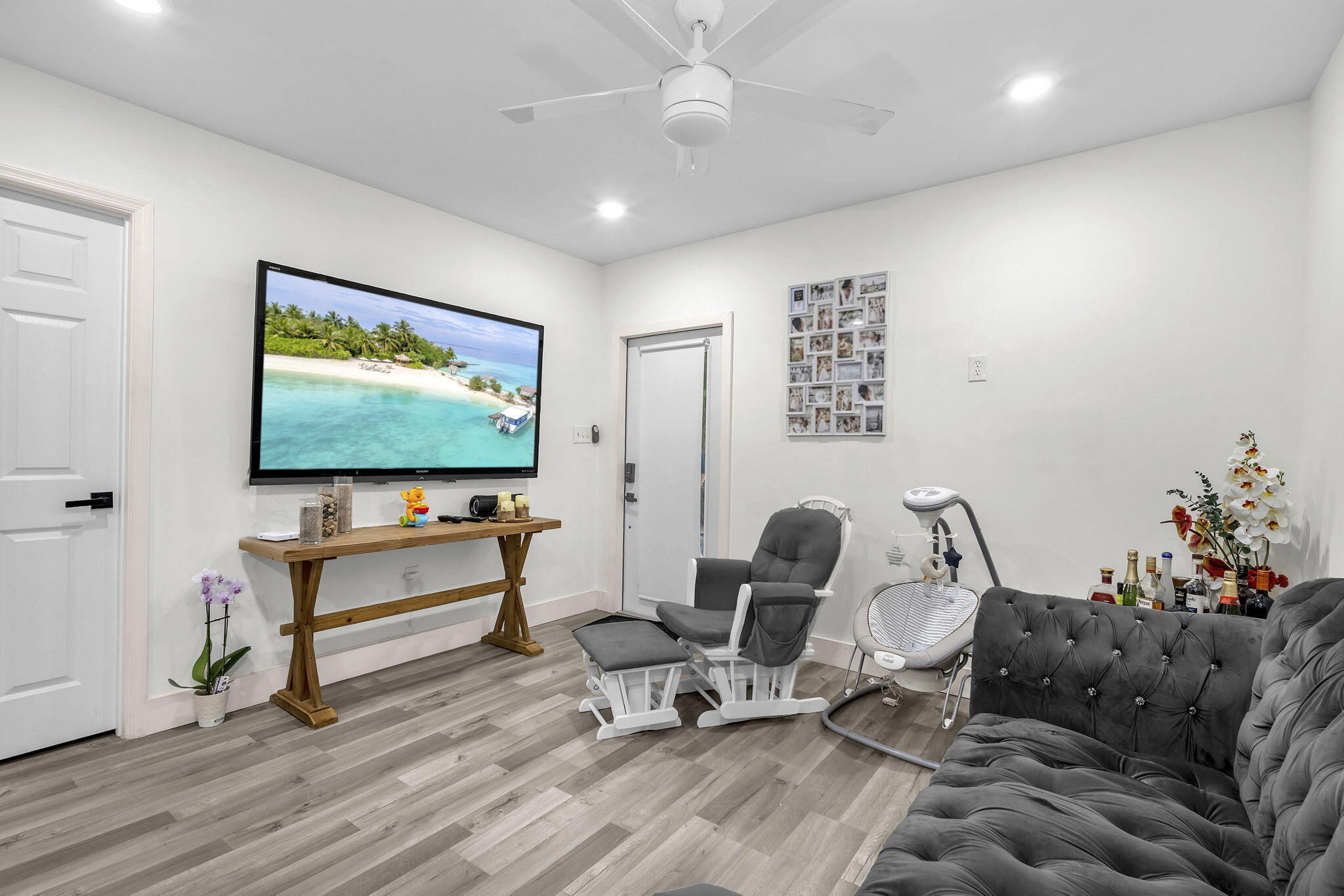 15225 Southwest 235th Street Homestead, FL 33032 - Photo 48 of 96 a living room with furniture and a flat screen tv