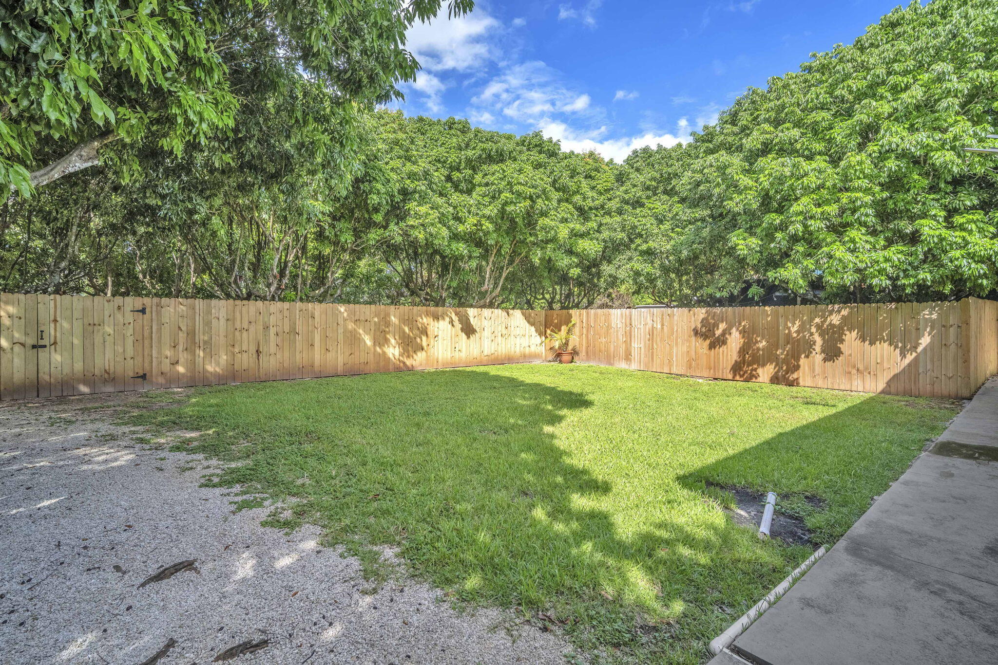 15225 Southwest 235th Street Homestead, FL 33032 - Photo 66 of 96 a view of yard with swimming pool and green space
