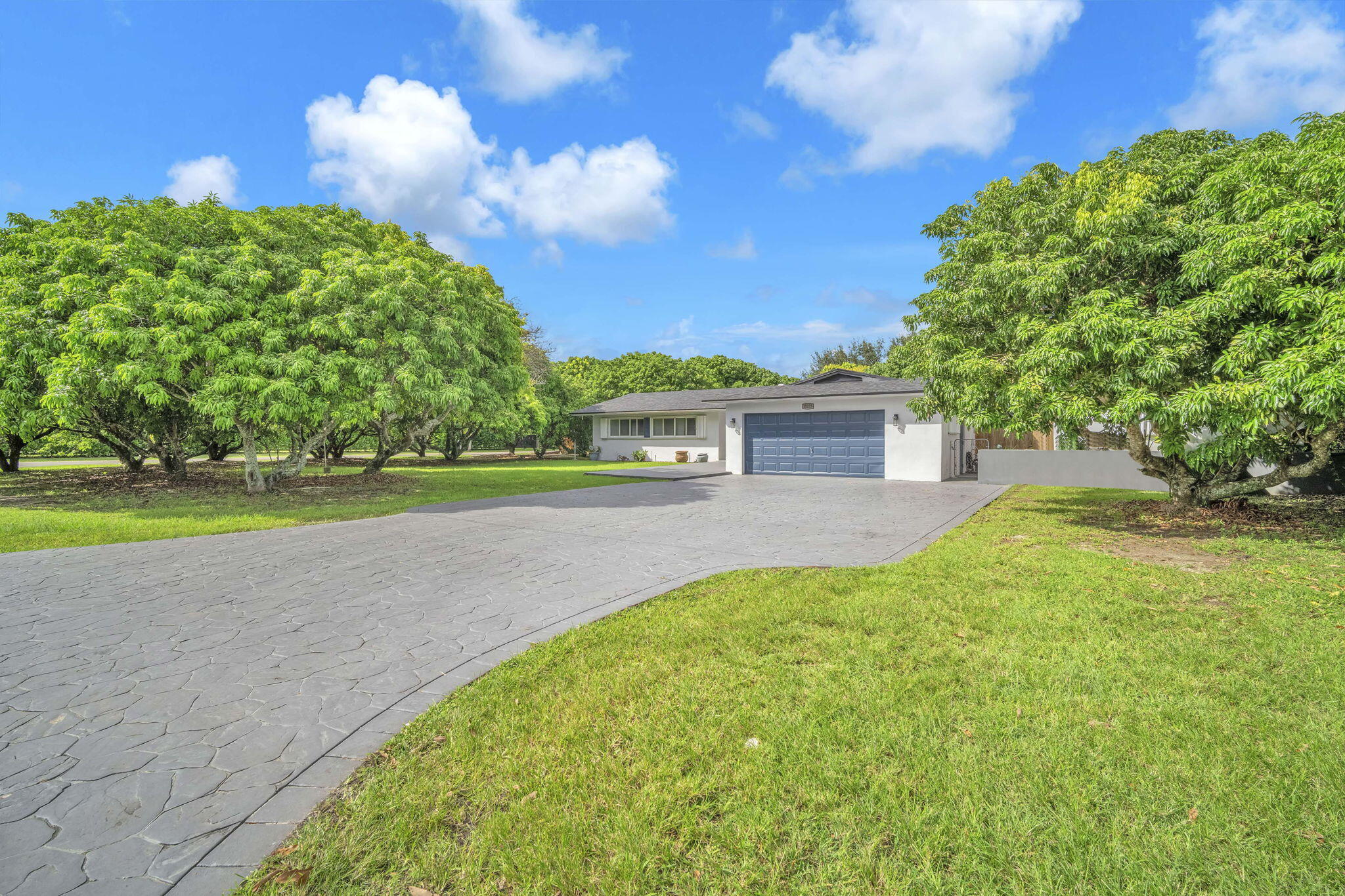 15225 Southwest 235th Street Homestead, FL 33032 - Photo 76 of 96 a view of a house with a yard
