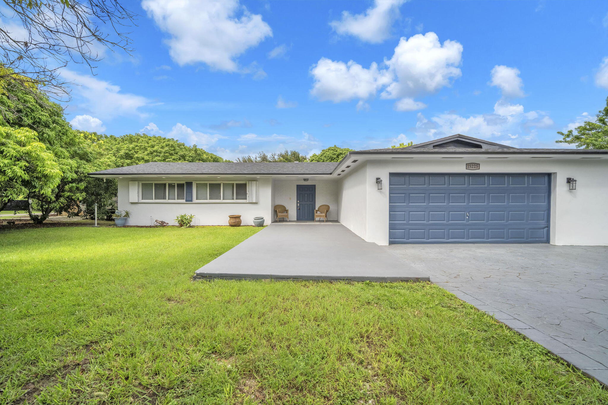 15225 Southwest 235th Street Homestead, FL 33032 - Photo 77 of 96 a front view of a house with a yard