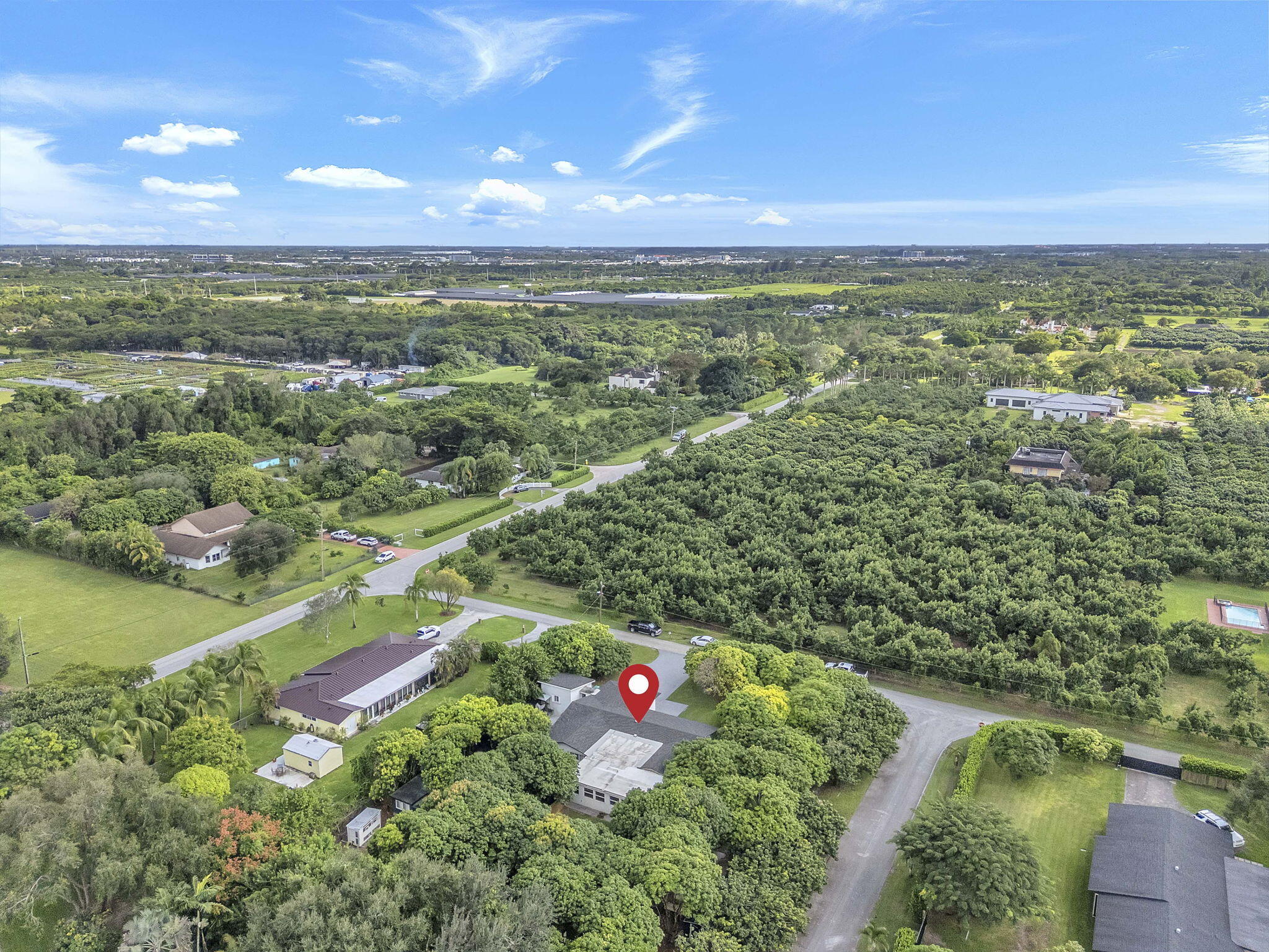 15225 Southwest 235th Street Homestead, FL 33032 - Photo 86 of 96 an aerial view of residential houses with outdoor space and swimming pool