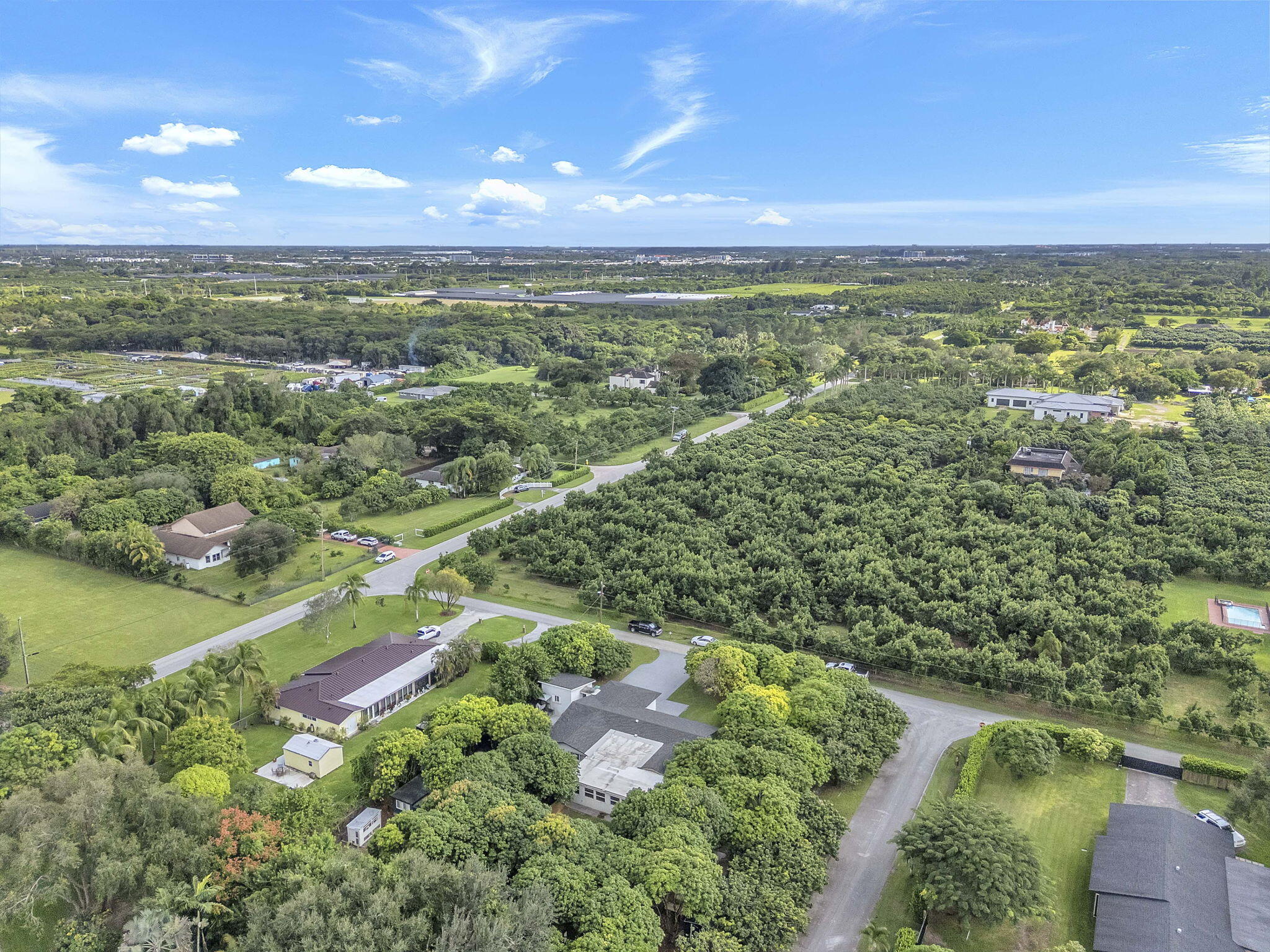 15225 Southwest 235th Street Homestead, FL 33032 - Photo 87 of 96 an aerial view of residential houses with outdoor space and trees