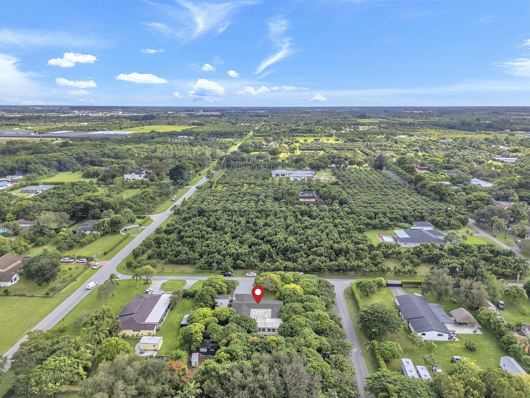 15225 Southwest 235th Street Homestead, FL 33032 - Photo 88 of 96 an aerial view of residential houses with outdoor space and trees