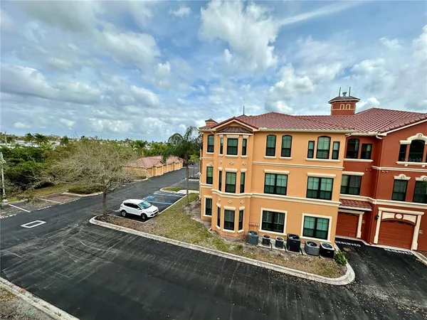 a view of a room with wooden floor and front door