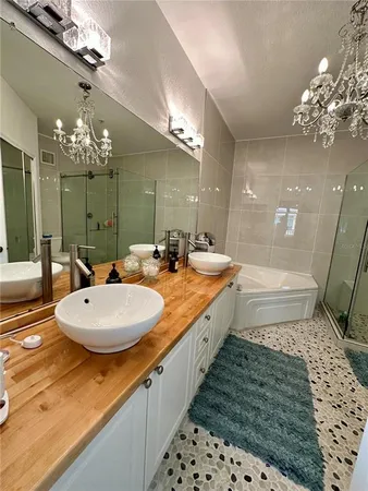 a bathroom with a bathtub and a shower