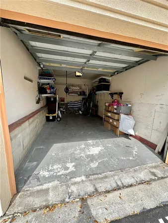 a view of a patio with furniture and a lake view