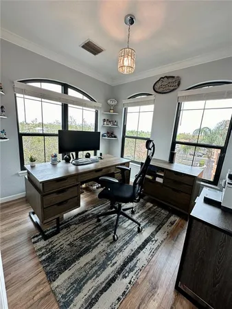 a kitchen with kitchen island granite countertop a sink stove and refrigerator