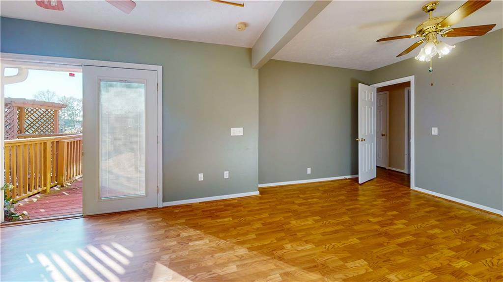 40 Lois Road Southwest Euharlee, GA 30120 - Photo 12 of 37 a view of an empty room with wooden floor and a window