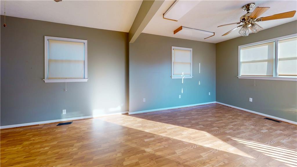 40 Lois Road Southwest Euharlee, GA 30120 - Photo 14 of 37 a view of an empty room with window and chandelier fan