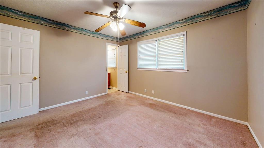 40 Lois Road Southwest Euharlee, GA 30120 - Photo 23 of 37 an empty room with windows and fan