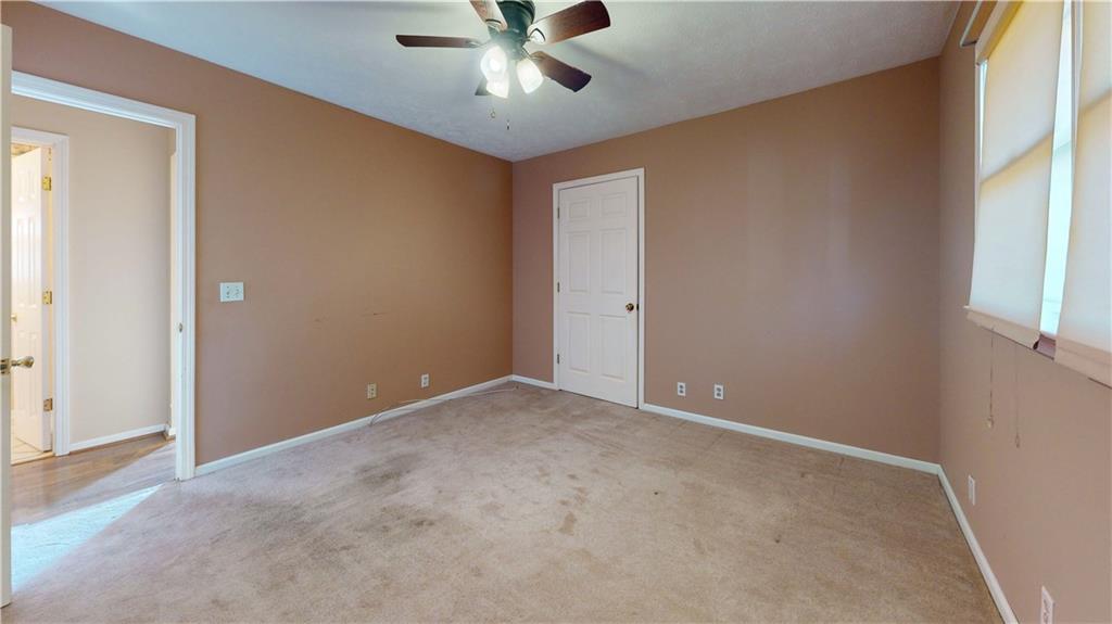 40 Lois Road Southwest Euharlee, GA 30120 - Photo 24 of 37 a view of an empty room with chandelier fan and fire place