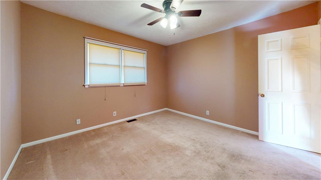 40 Lois Road Southwest Euharlee, GA 30120 - Photo 25 of 37 an empty room with a window and a fan