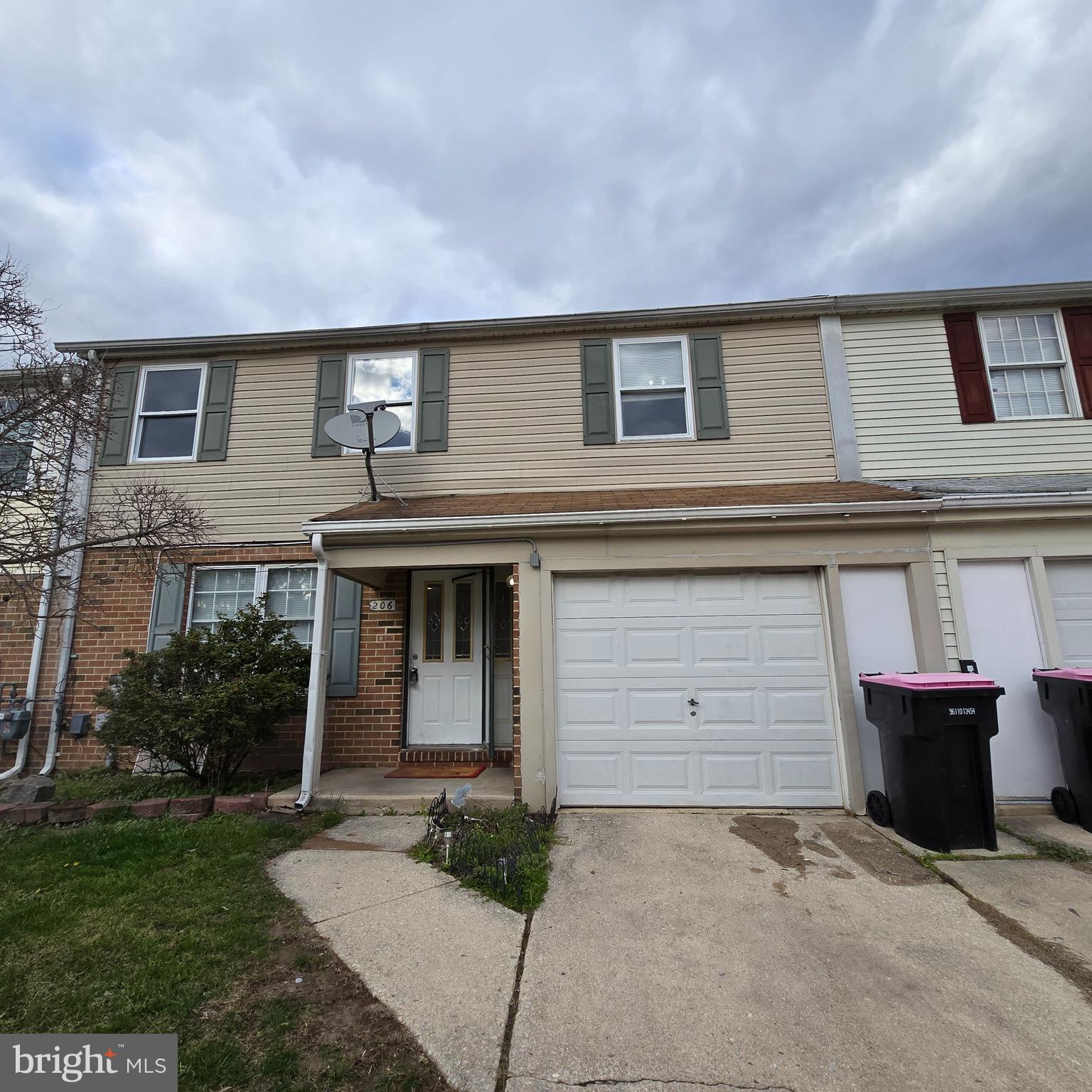 a front view of a house with garage