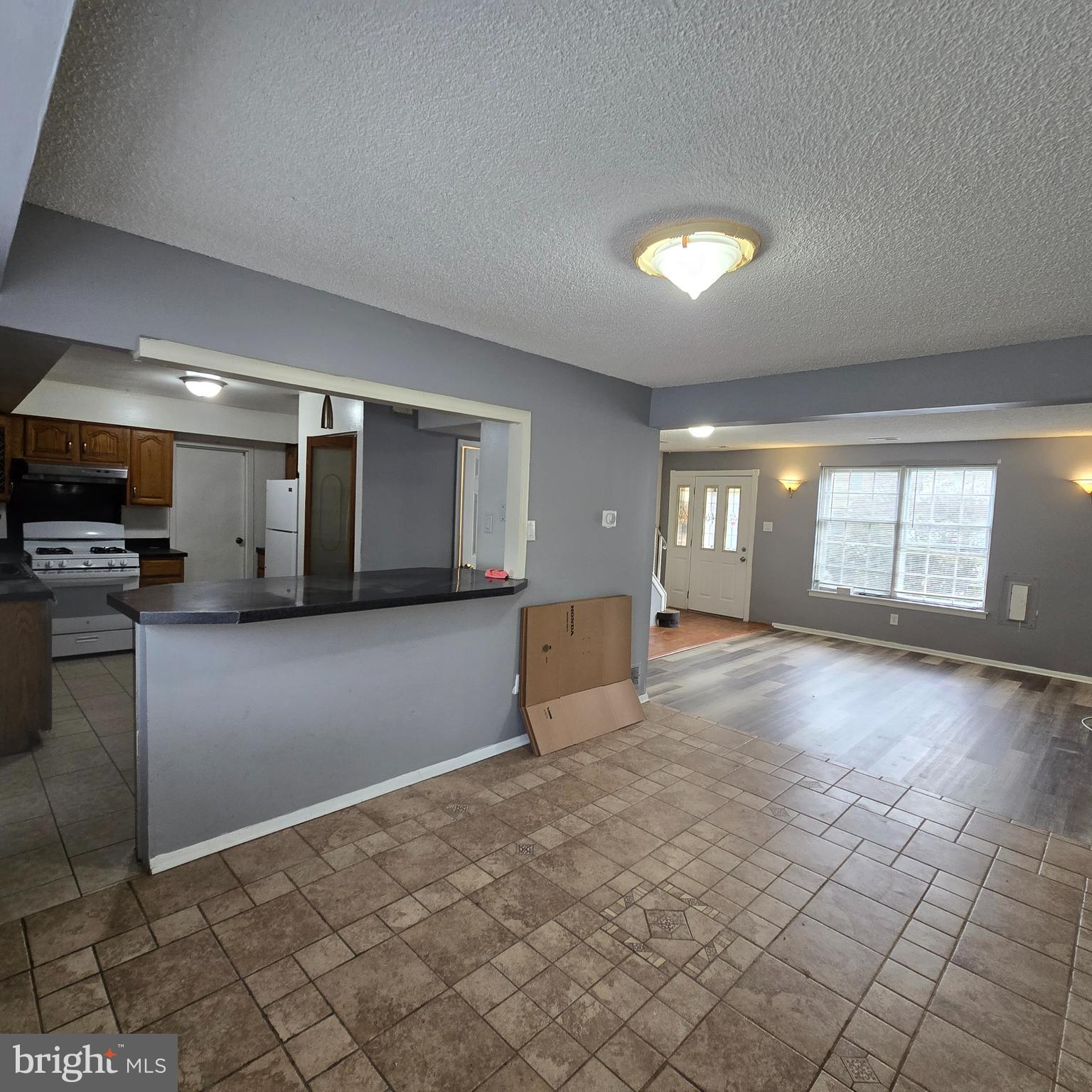 206 Hollybush Place Clementon, NJ 08021 - Photo 4 of 17 a view of a room with kitchen appliances and windows