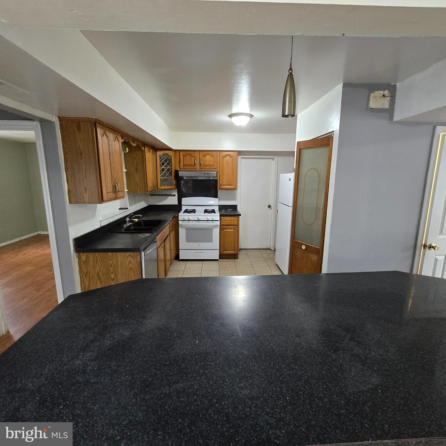 206 Hollybush Place Clementon, NJ 08021 - Photo 5 of 17 a kitchen with refrigerator and microwave