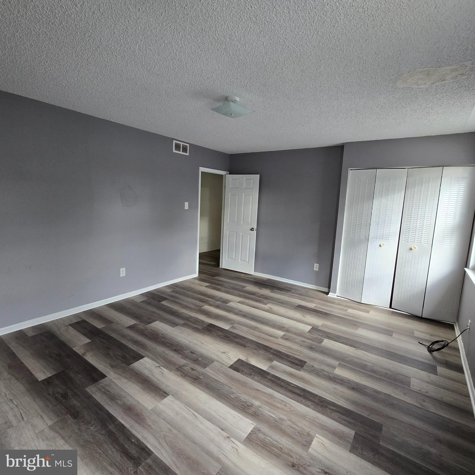 206 Hollybush Place Clementon, NJ 08021 - Photo 9 of 17 a bedroom with a bed and wooden floor