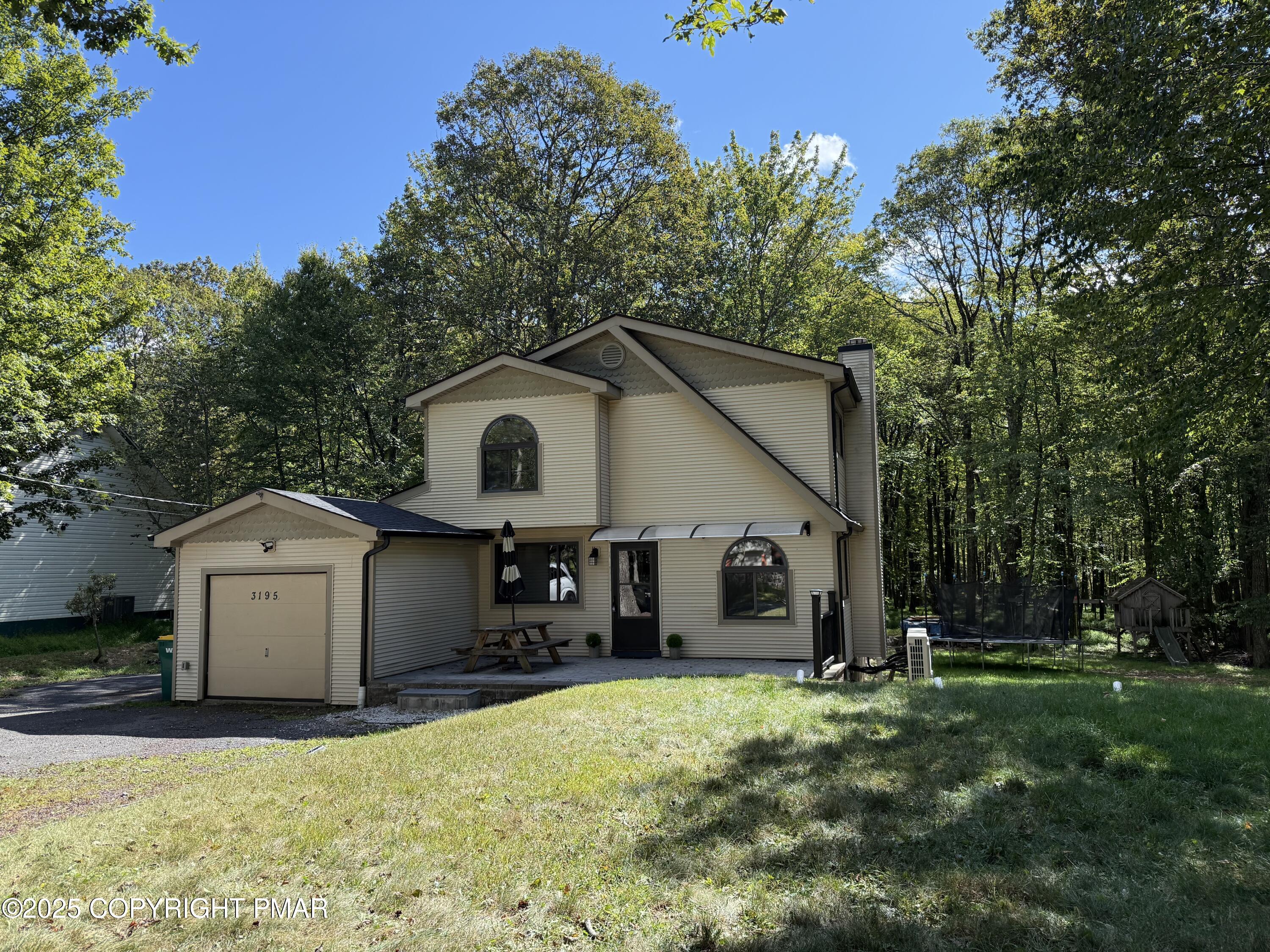 3195 Hamlet Drive Tobyhanna, PA 18466 - Photo 1 of 19 a view of a house with backyard and garden