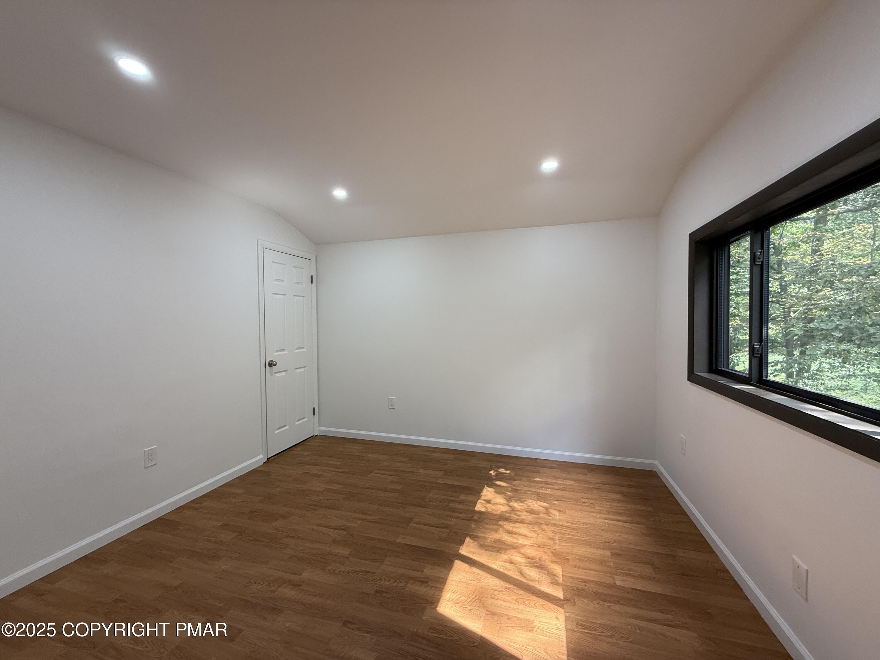 3195 Hamlet Drive Tobyhanna, PA 18466 - Photo 17 of 19 a view of room with window and wooden floor