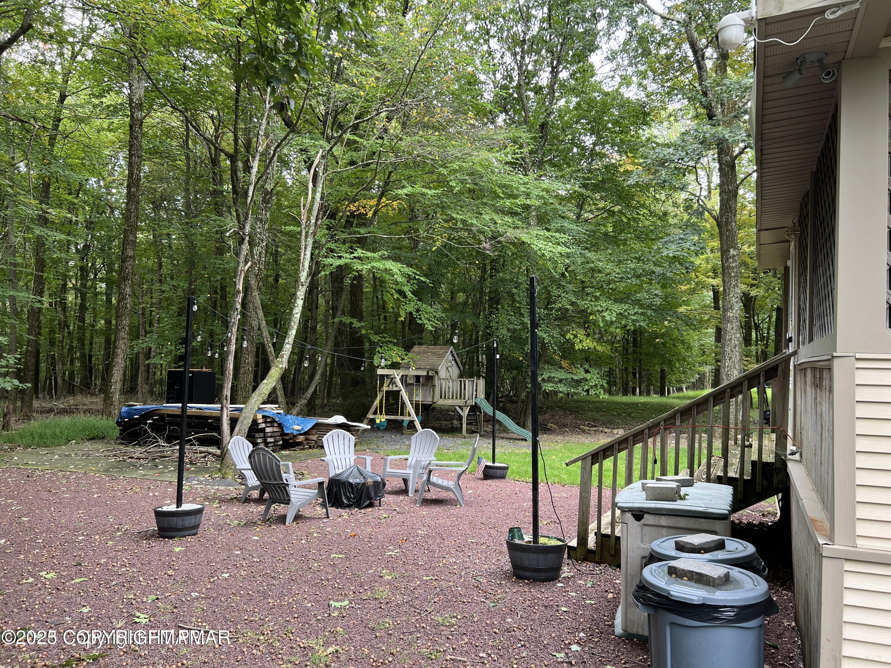 3195 Hamlet Drive Tobyhanna, PA 18466 - Photo 19 of 19 a view of a chairs and table in the patio next to a yard