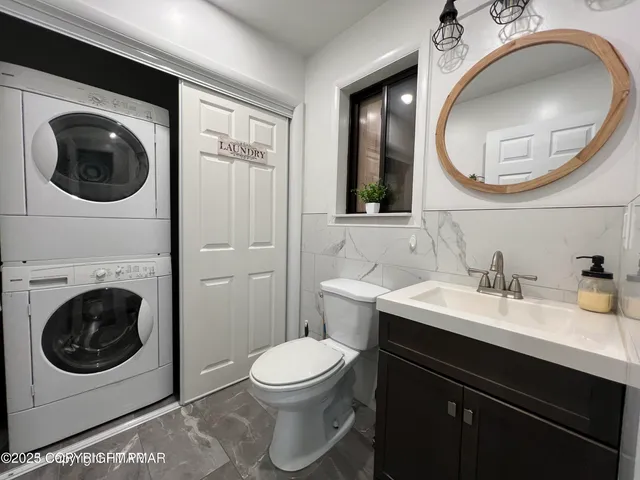 a bathroom with a sink a mirror and a toilet