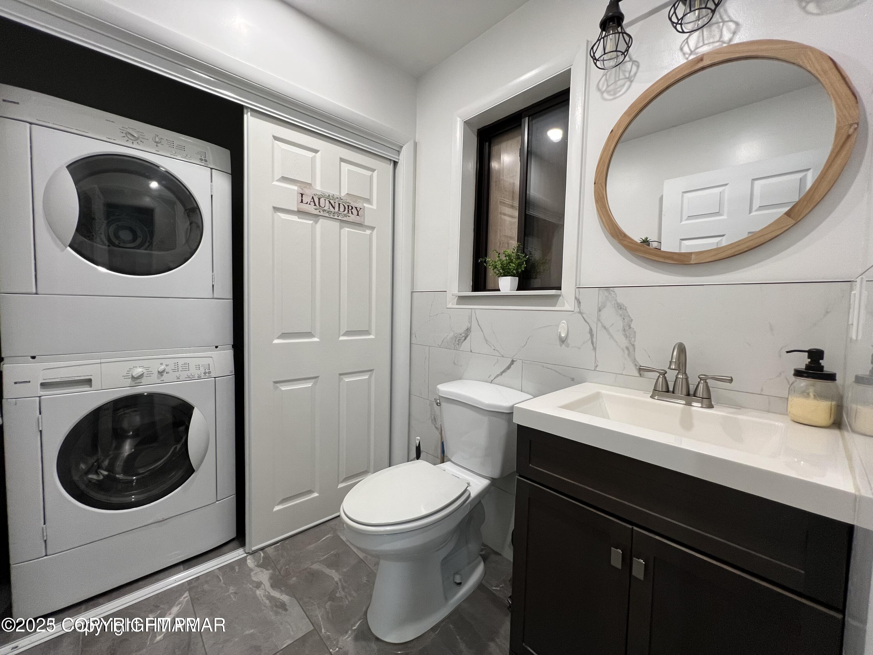 3195 Hamlet Drive Tobyhanna, PA 18466 - Photo 8 of 19 a bathroom with a sink a mirror and a toilet