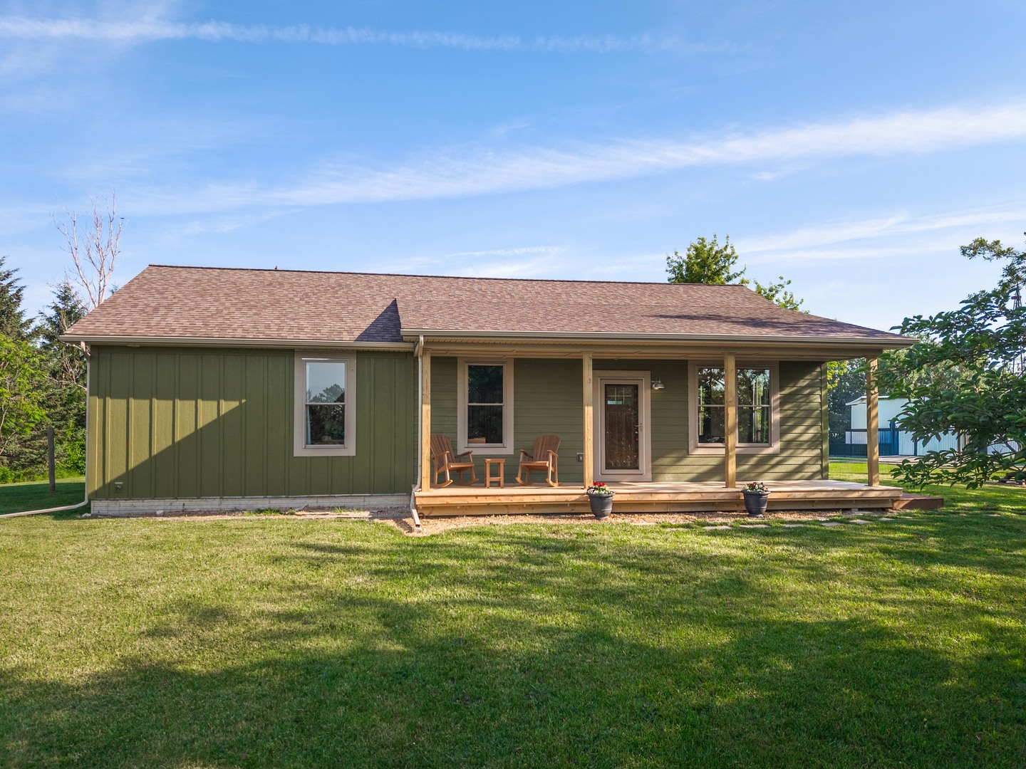 22037 East 2600 N Road Odell, IL 60460 - Photo 4 of 59 a front view of a house with a garden and yard