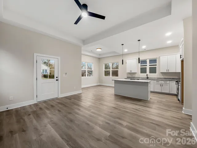 a view of kitchen with wooden floor