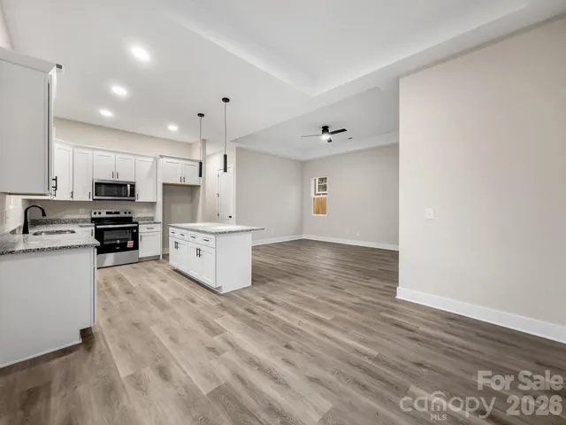 a view of kitchen with wooden floor