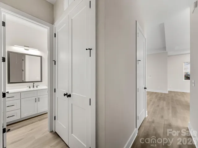 a bathroom with a double vanity sink and mirror