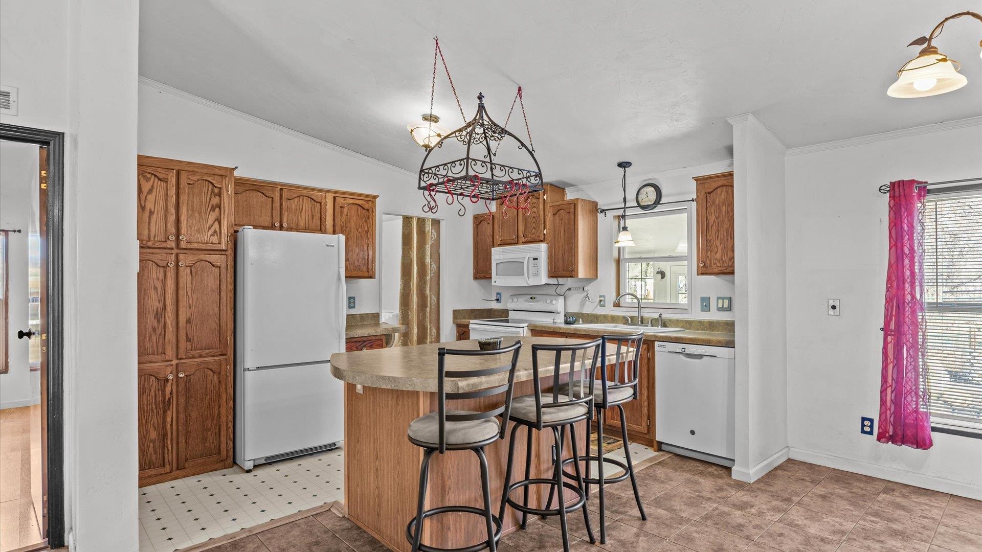 777 1550th Road Delta, CO 81416 - Photo 11 of 32 a dining table chair next to a window