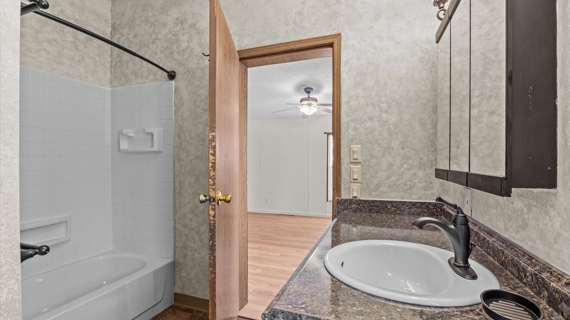 777 1550th Road Delta, CO 81416 - Photo 17 of 32 a bathroom with a sink and a mirror