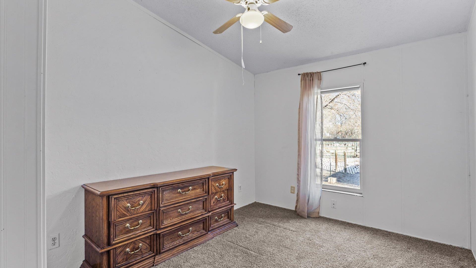 777 1550th Road Delta, CO 81416 - Photo 20 of 32 a view of an empty room with a window