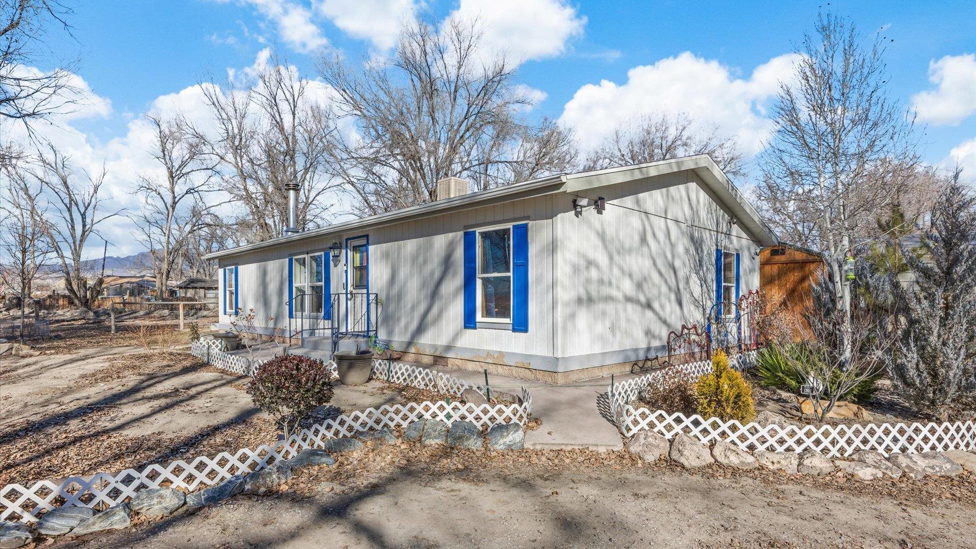777 1550th Road Delta, CO 81416 - Photo 2 of 32 a view of a house with a yard