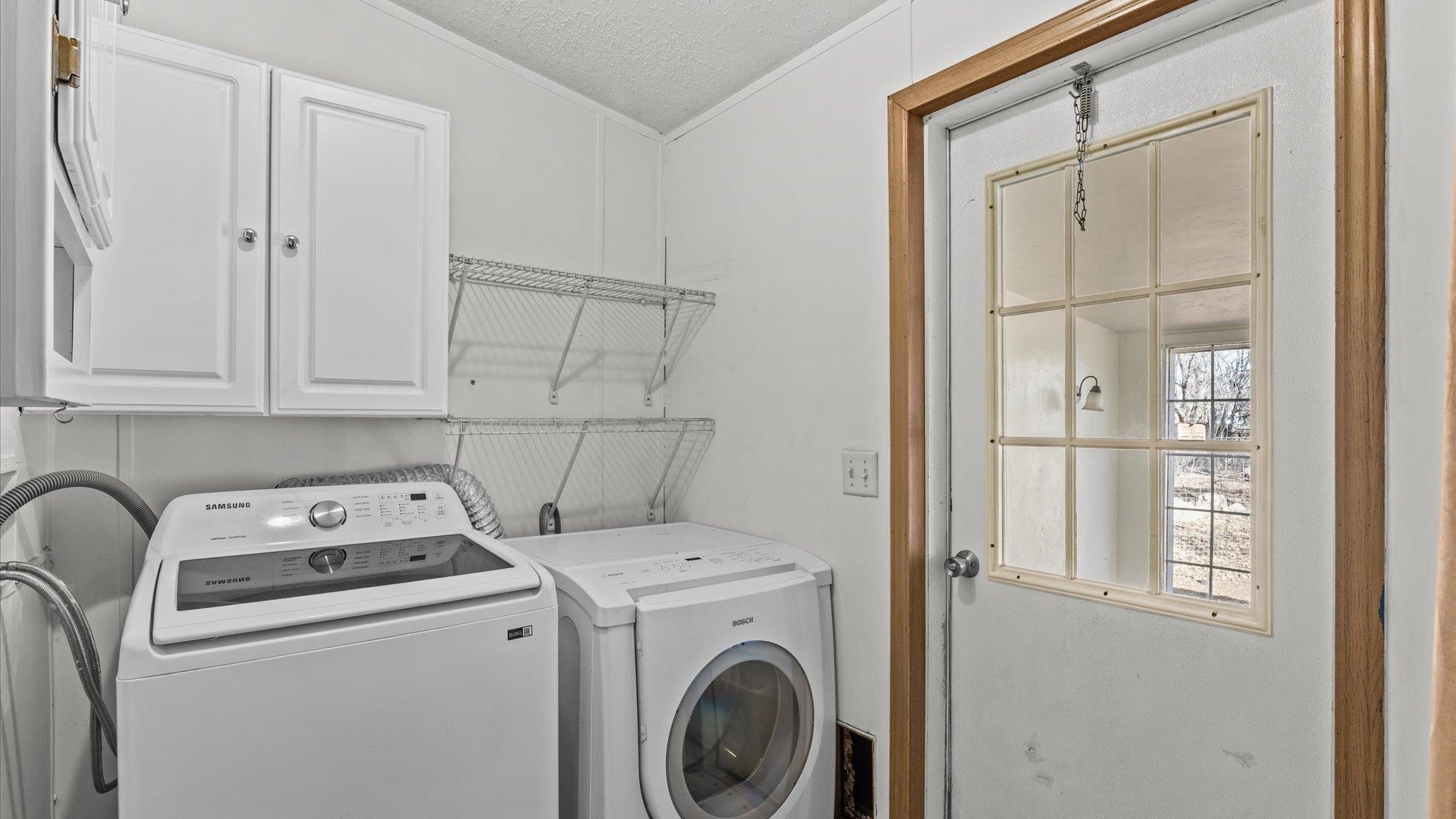777 1550th Road Delta, CO 81416 - Photo 24 of 32 a utility room with dryer and washer