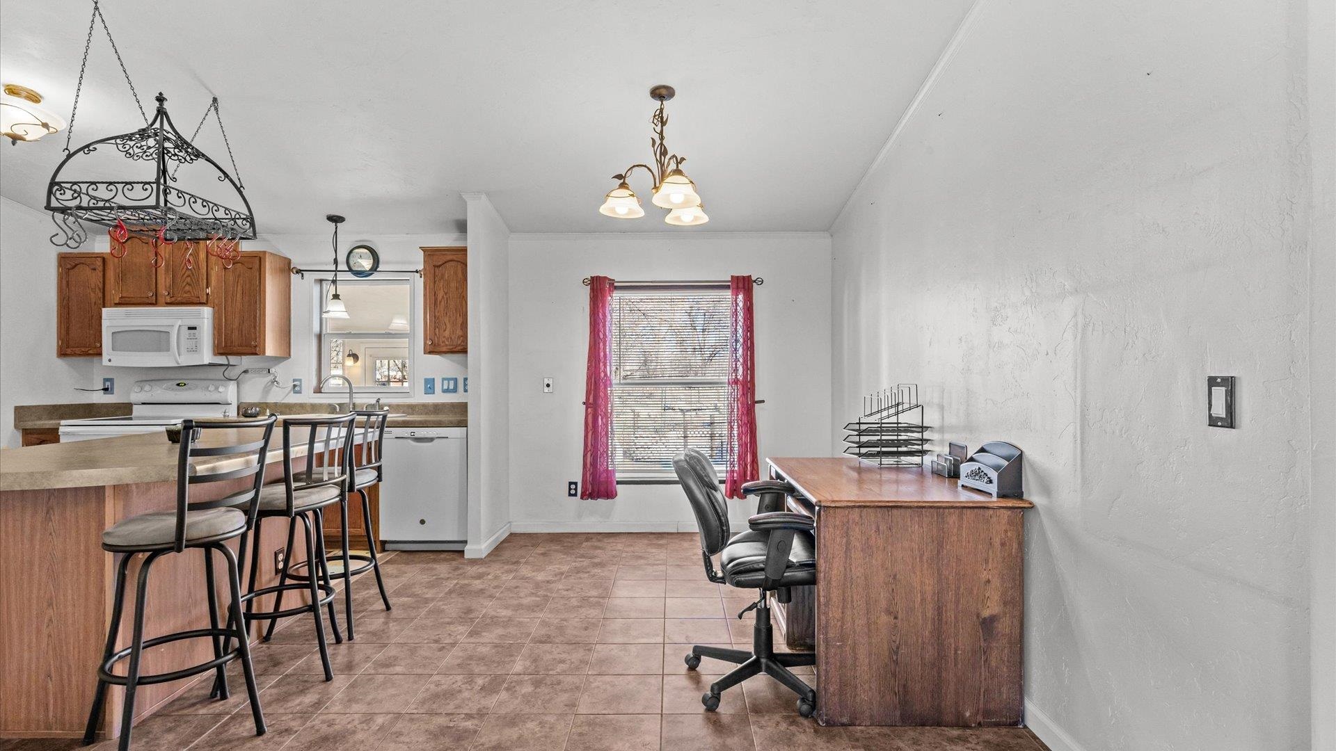 777 1550th Road Delta, CO 81416 - Photo 10 of 32 a view of a kitchen and dining area