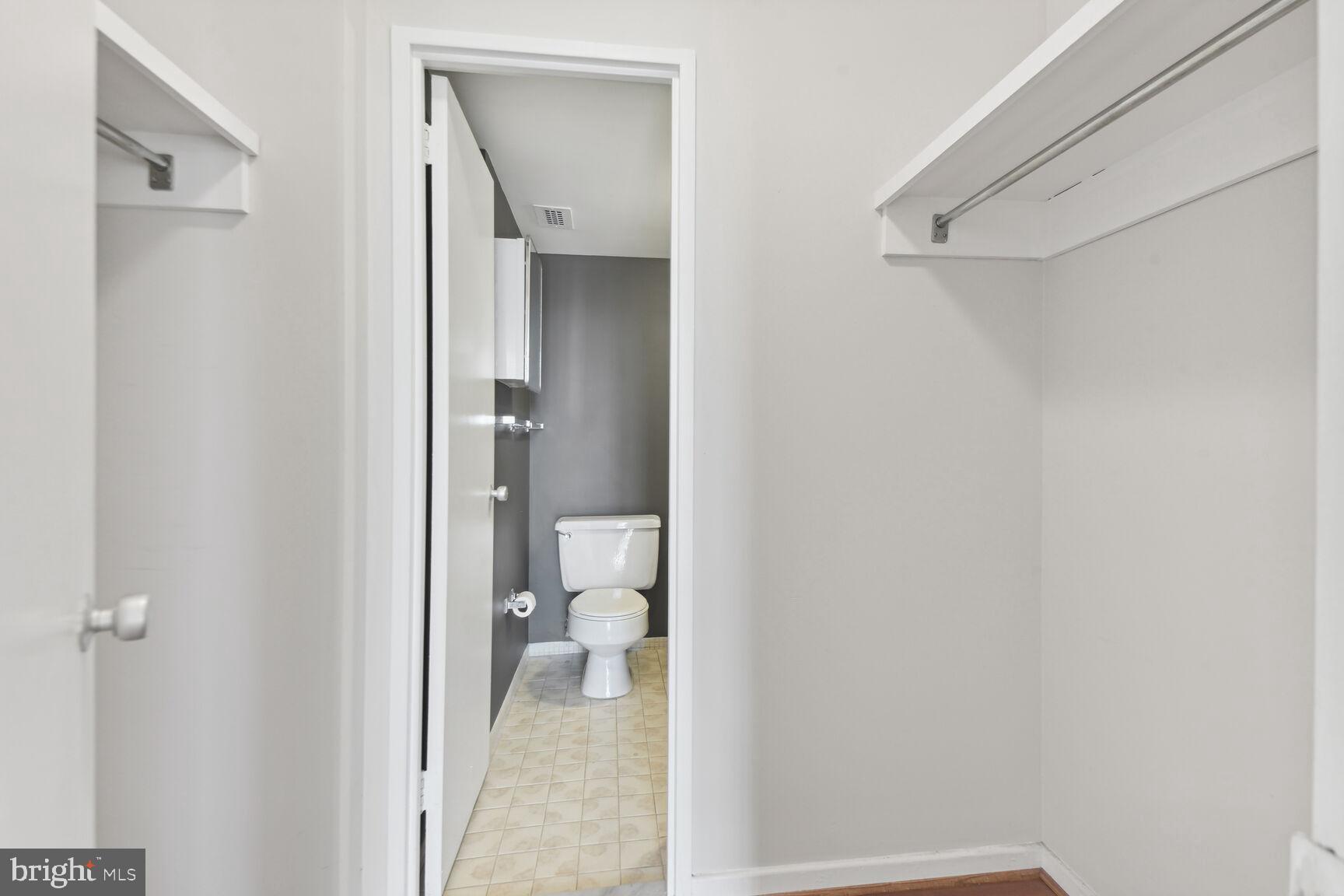 1250 4th Street Southwest, Unit W413 Washington, DC 20024 - Photo 14 of 36 Half bath attached to the primary bedroom