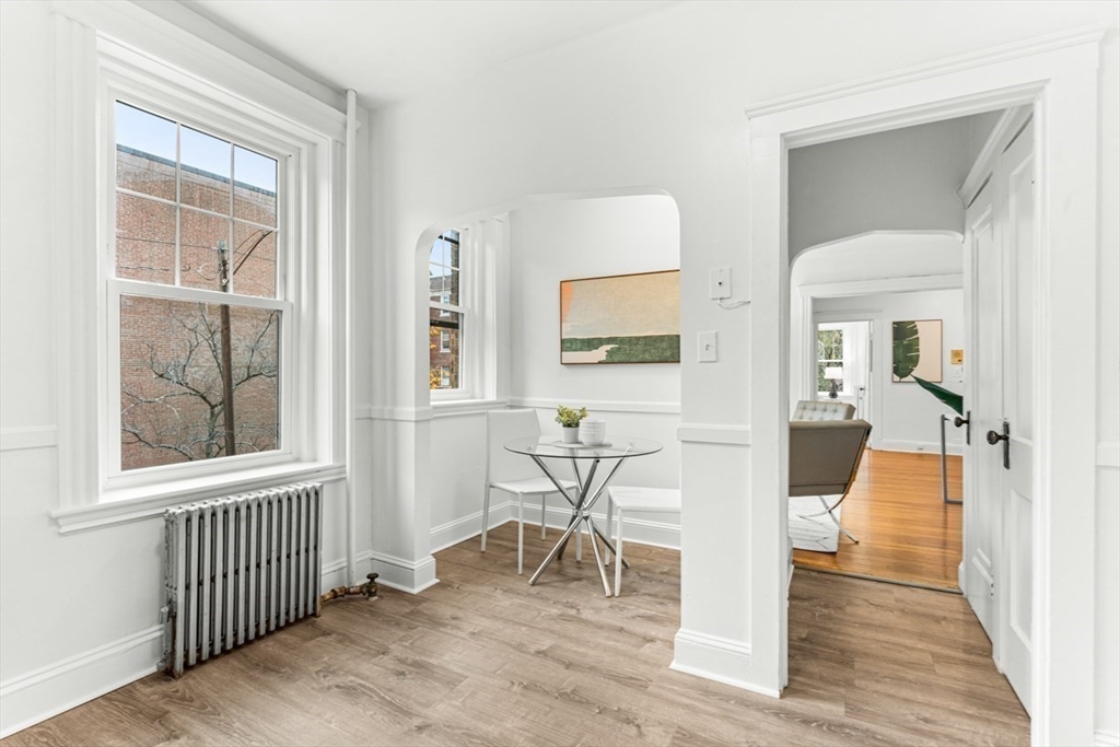 72 Strathmore Road, Unit 5B Boston, MA 02135 - Photo 9 of 18 a view of a livingroom with furniture and hardwood floor