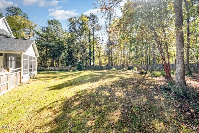 a view of a yard with a tree