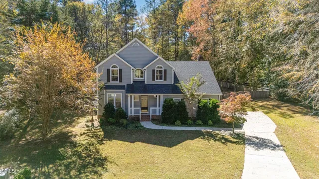 a view of swimming pool with a yard and sitting space