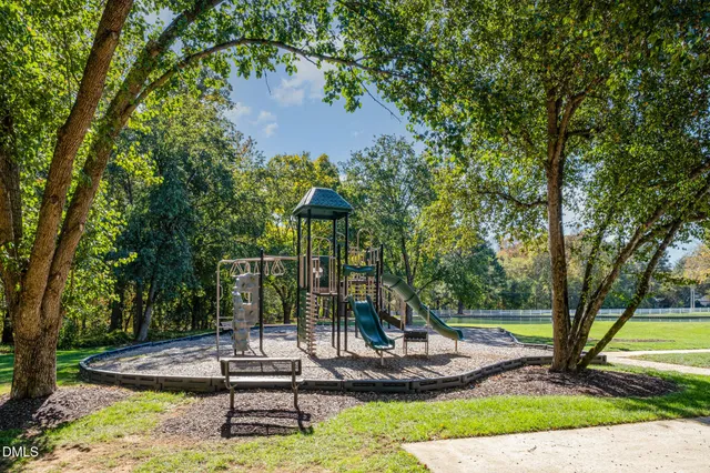 a view of a swimming pool with a yard