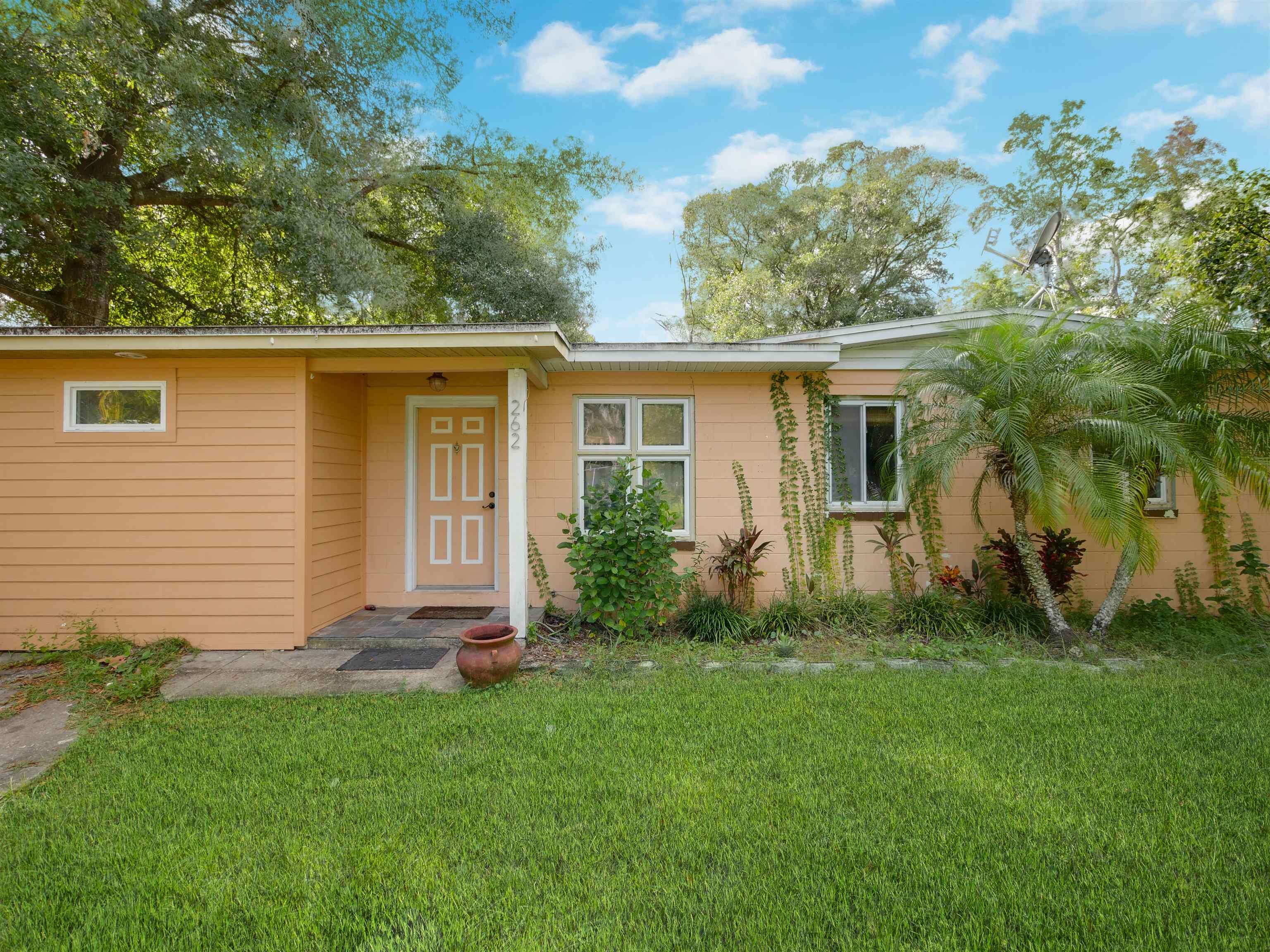 262 Spring Street St. Augustine, FL 32084 - Photo 1 of 25 a front view of house with yard and green space