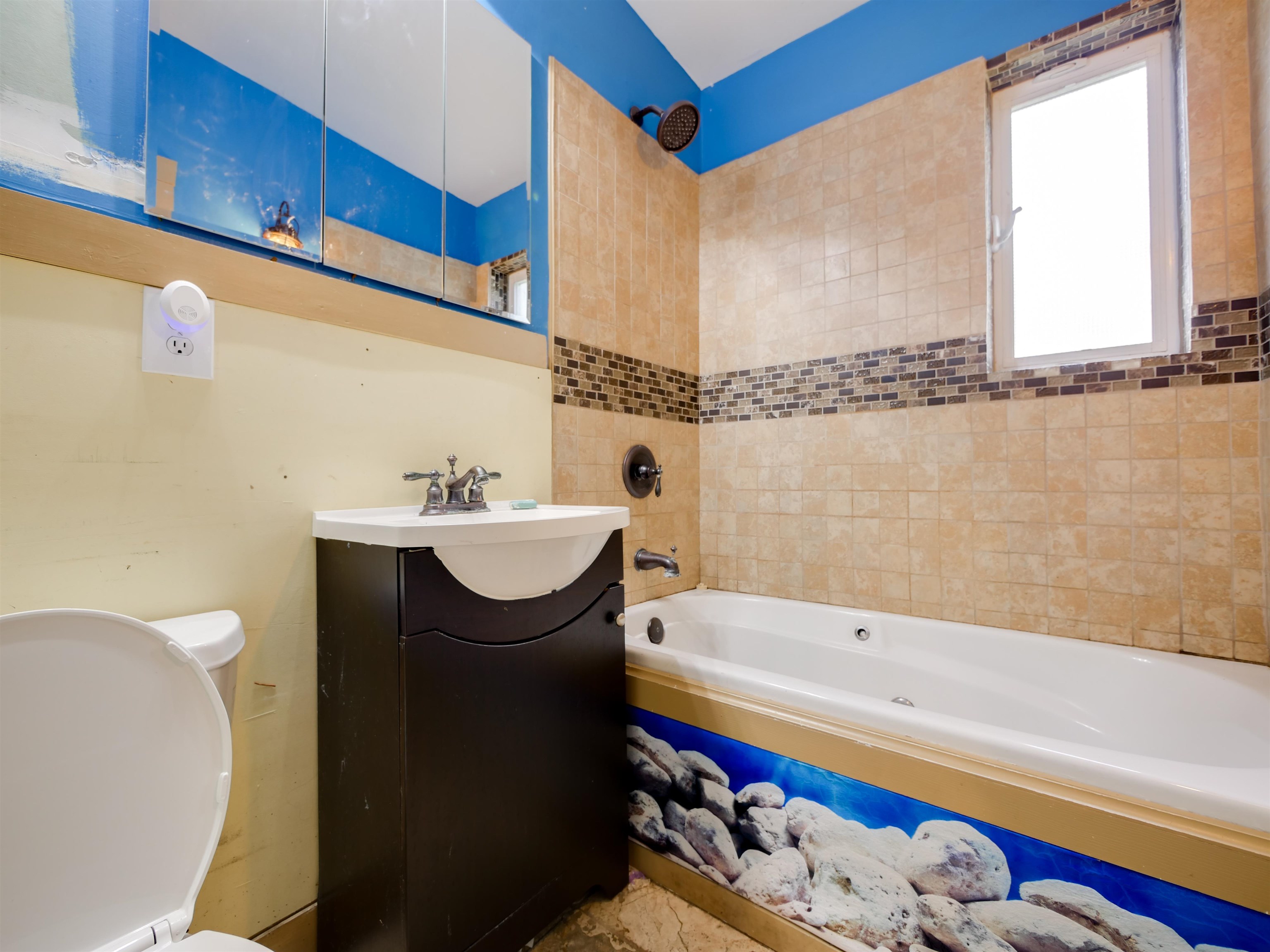 262 Spring Street St. Augustine, FL 32084 - Photo 11 of 25 a bathroom with a sink a bathtub and a shower