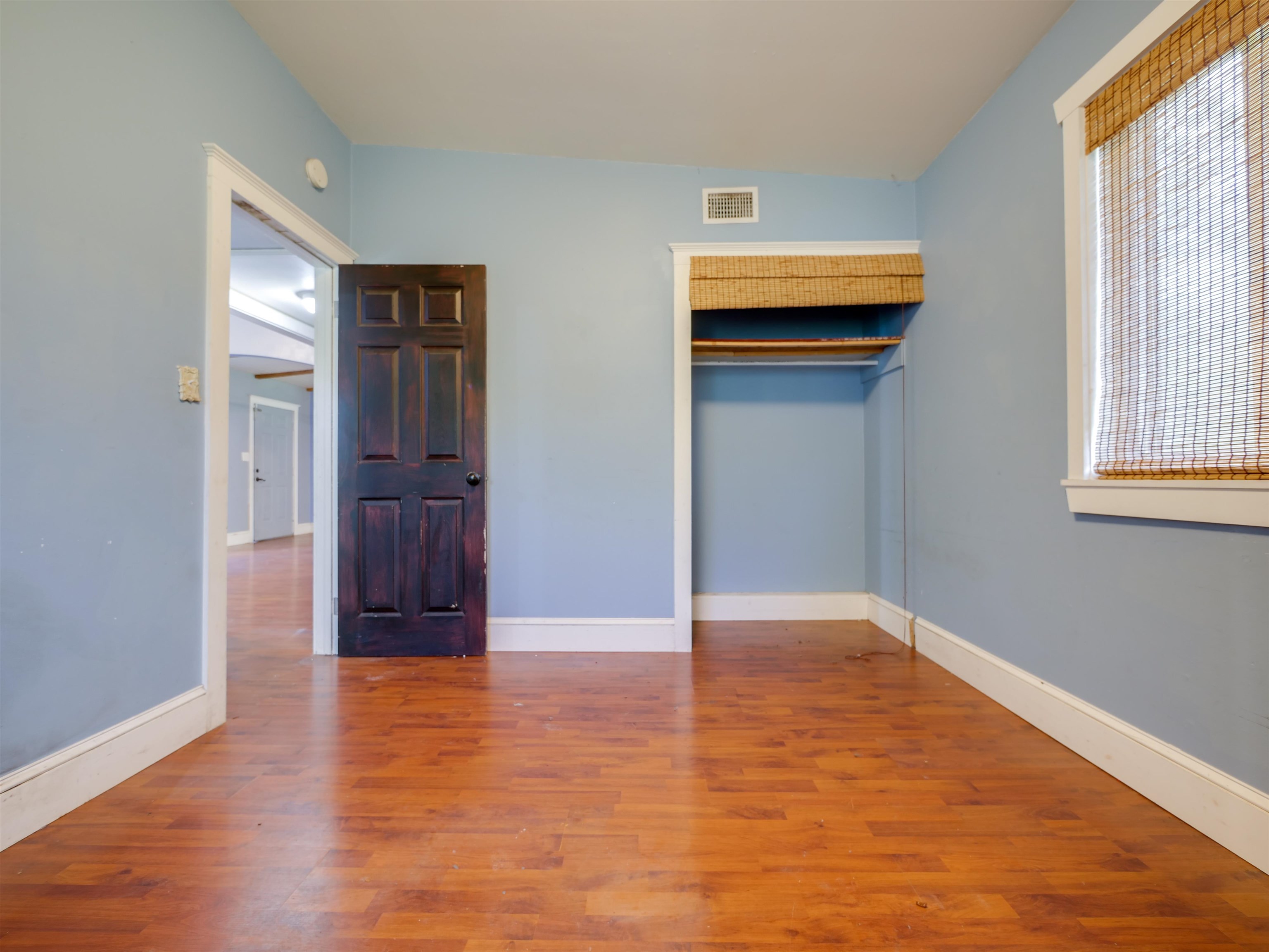 262 Spring Street St. Augustine, FL 32084 - Photo 18 of 25 a view of an empty room with wooden floor and a window