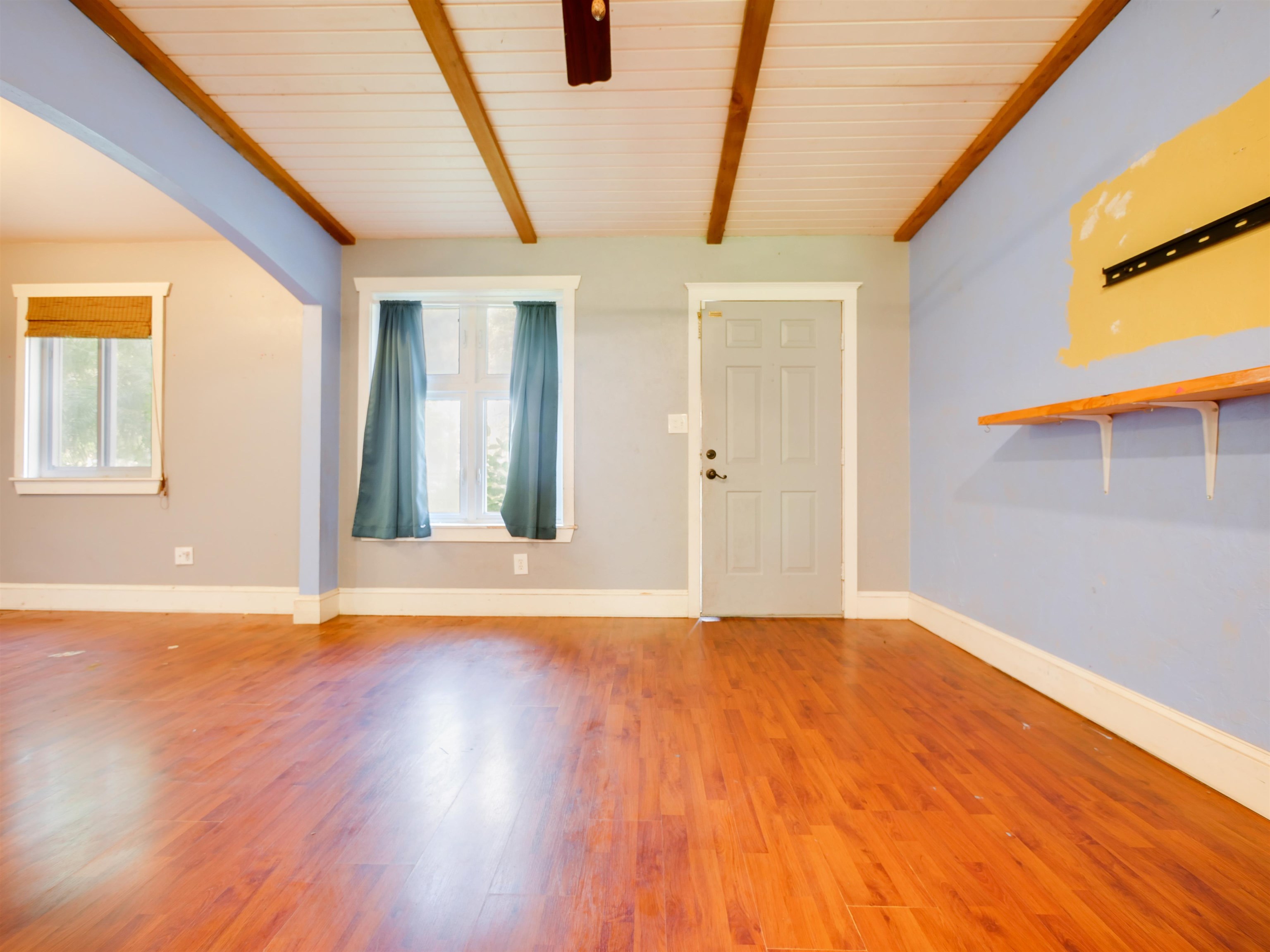 262 Spring Street St. Augustine, FL 32084 - Photo 3 of 25 a view of an empty room with wooden floor and a window