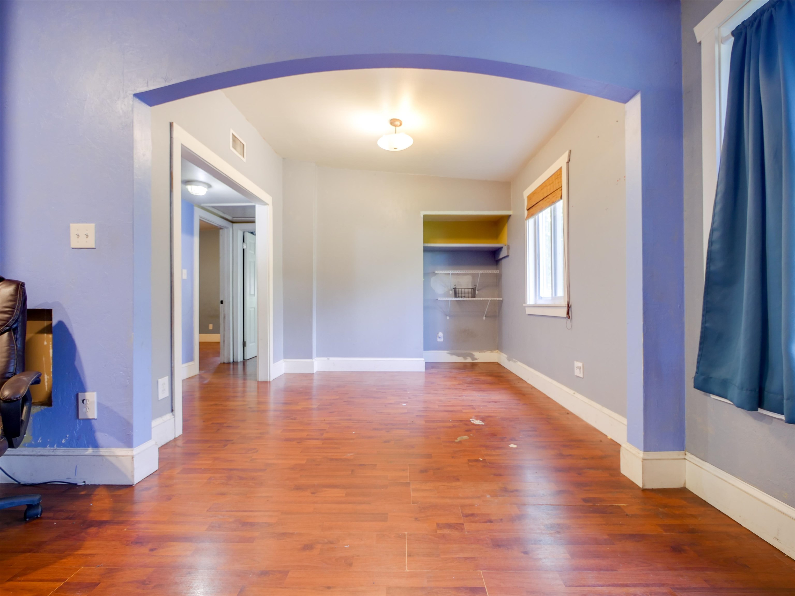 262 Spring Street St. Augustine, FL 32084 - Photo 6 of 25 a view of a hallway with wooden floor and a bathroom