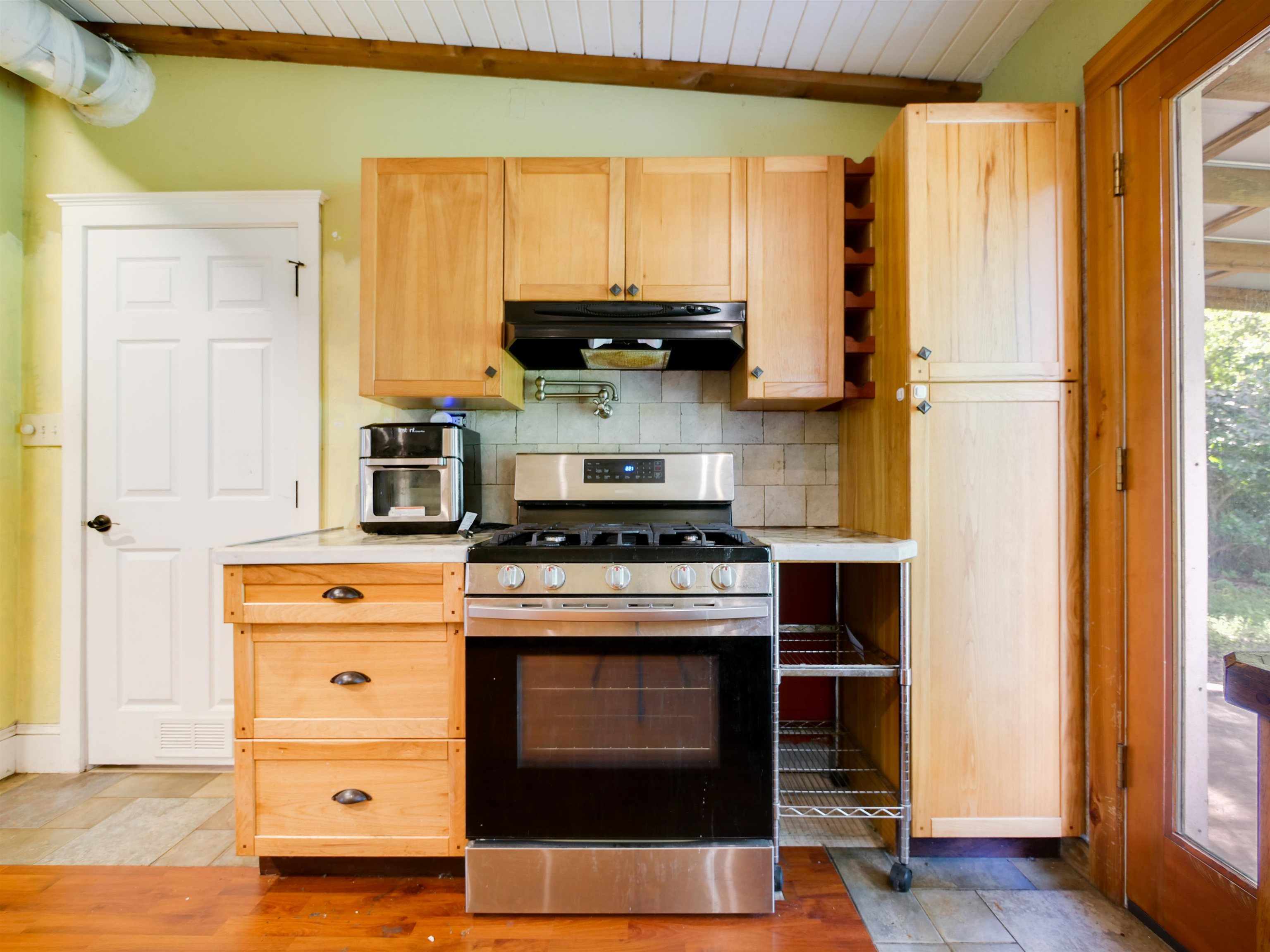 262 Spring Street St. Augustine, FL 32084 - Photo 9 of 25 a kitchen with a stove and a refrigerator