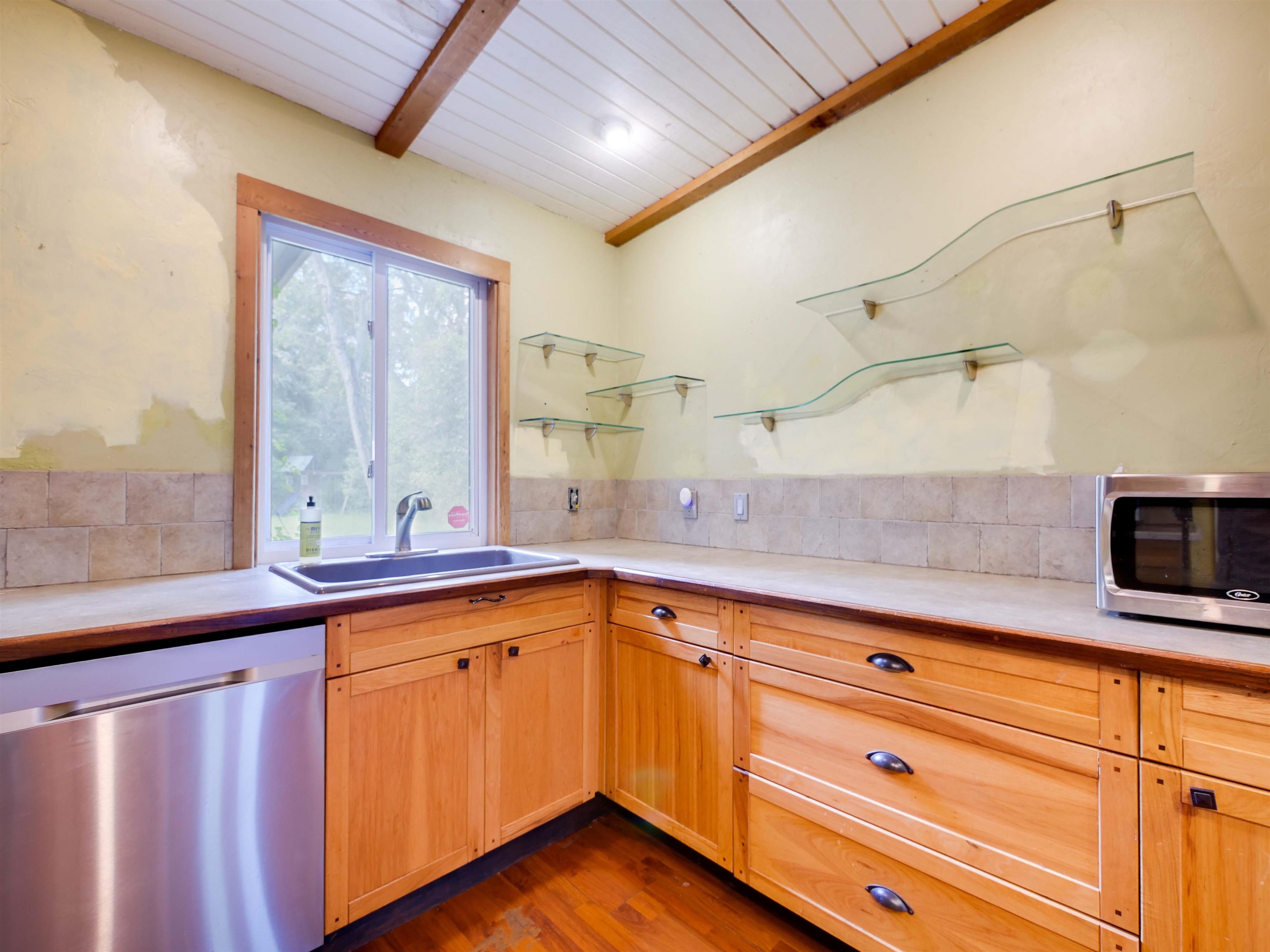 262 Spring Street St. Augustine, FL 32084 - Photo 10 of 25 a kitchen with sink cabinets and window