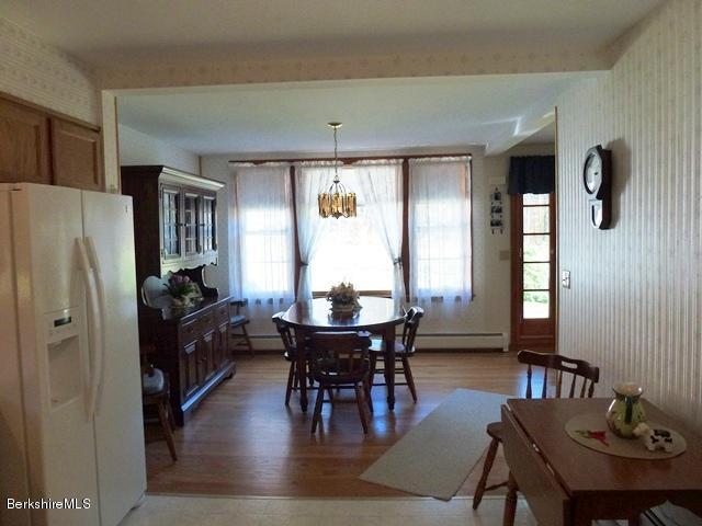 457 Horrigan Road Clarksburg, MA 01247 - Photo 12 of 32 a view of a a dining room with furniture window and wooden floor
