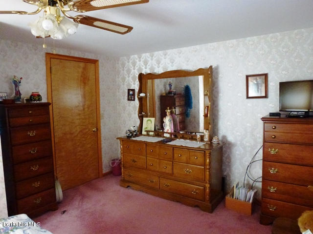 457 Horrigan Road Clarksburg, MA 01247 - Photo 17 of 32 a room with a dresser and a mirror