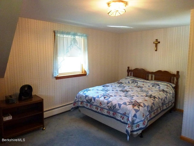 457 Horrigan Road Clarksburg, MA 01247 - Photo 19 of 32 a bedroom with a bed and a window